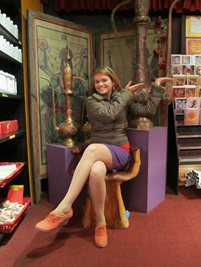 the author sitting on a chair shaped like a hand